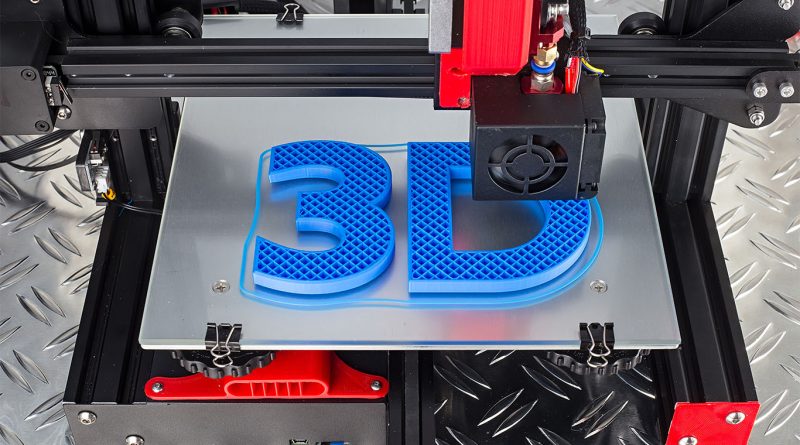 Image of a 3D-printer printing out the symbols '3' and 'D' in blue to support propulsion manufacturing article