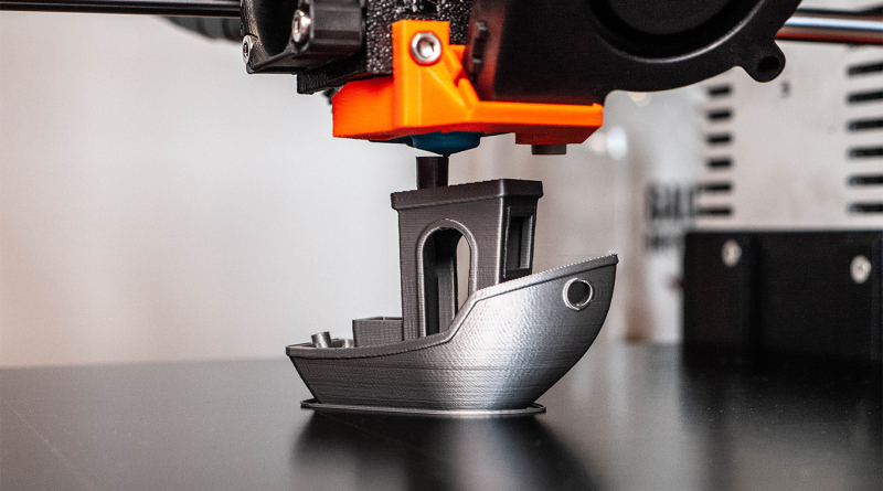 Image of a metal boat being 3D printed to support 3D printing article
