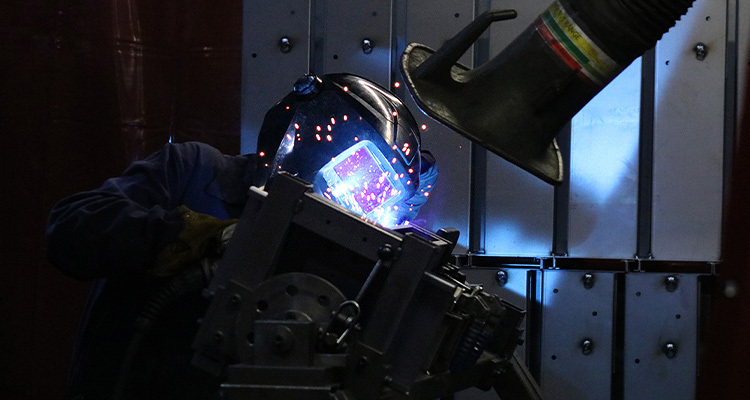 worker welding some machinery