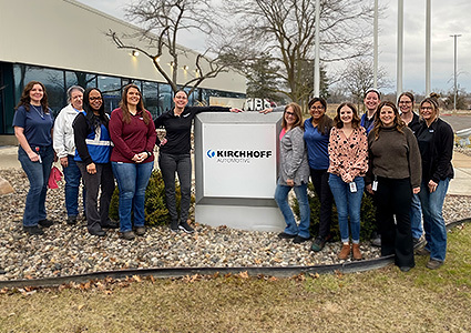 Kirchoff staff standing outside factory 