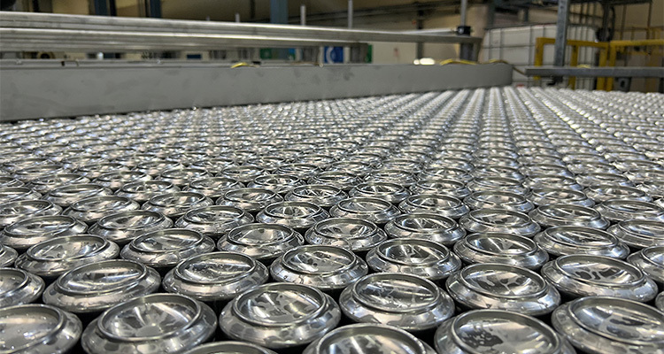 Hundreds of aluminium cans in a production line