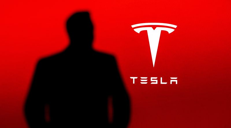 Image of a silohette of the Tesla CEO in front of the Tesla logo on a red background