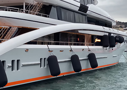 Three fenders off the side of a luxury yacht