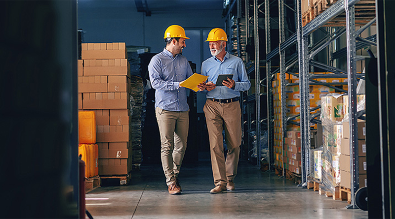 Two working professionals with hardhat walkign through site to support ESG data article