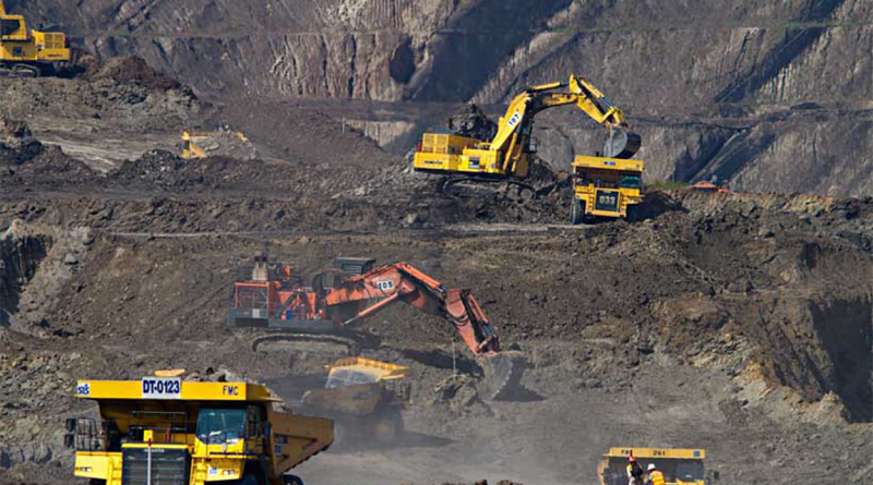 Mining site with machinery to support raw materials article