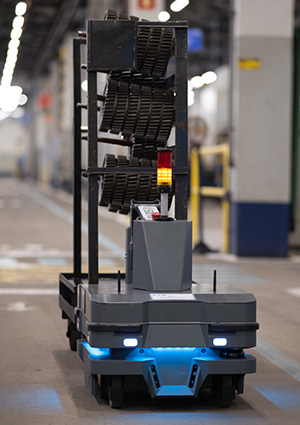 Mobile industrial robot carrying components