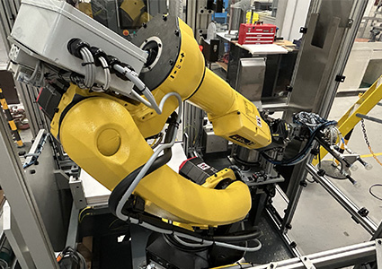 Yellow assembly robot in operation