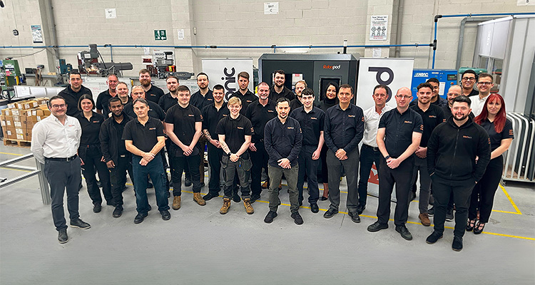 Mechtech Automation staff pose for picture inside facility