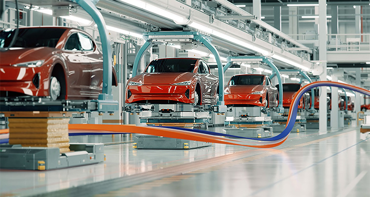 Red electric cars on a production line