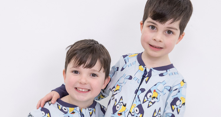 Iago and Twn Aykroyd (sixth generation of the Aykroyd family) modelling Bluey onesies