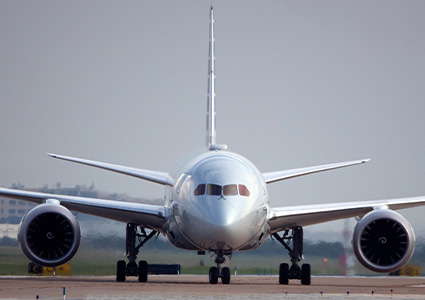 A front shot of an airplane getting ready for take off.