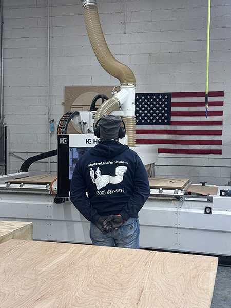 Modern Line Furniture's automated CNC wood cutting machine for tables and seating, located in the company's Hamilton, NJ factory.  Photo credit: Modern Line Furniture