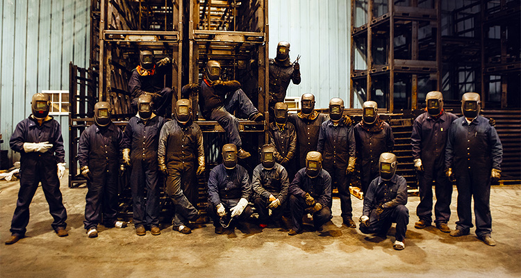 Parkfab welders posing for photograph wearing full welding gear