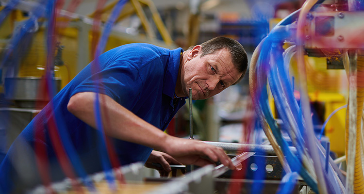 Engineer checking plastic extrusion