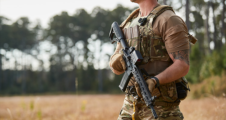Soldier holding semi-automatic rifle