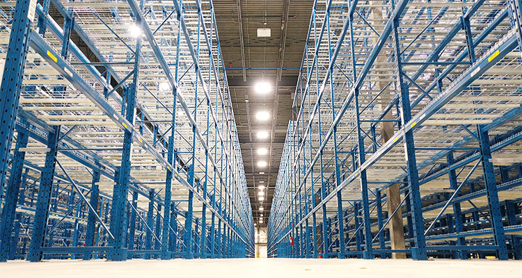 Empty blue metal pallet racking in a warehouse