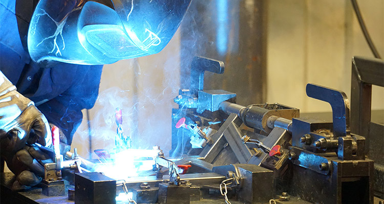 Man TIG welding components