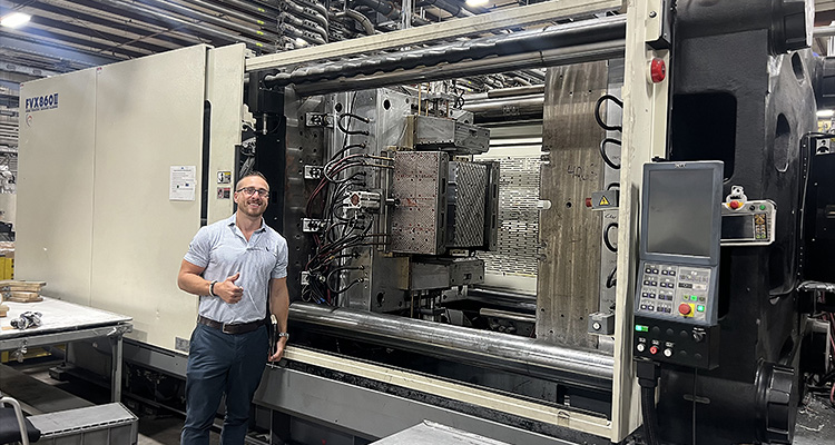 a large industrial plastic injection molding machine