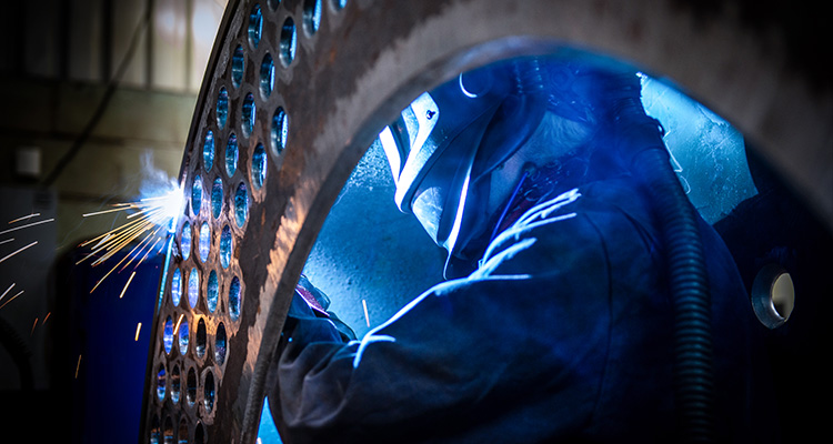 How Byworth Boilers leverages its engineering excellence to meet sustainability demands welder working on a large metal structure