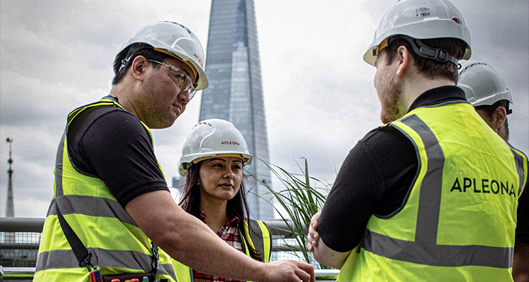 Integrated, innovative and impressive to the core, Apleona UK represents the finest in facility management construction or site workers, wearing hard hats and high-visibility vests