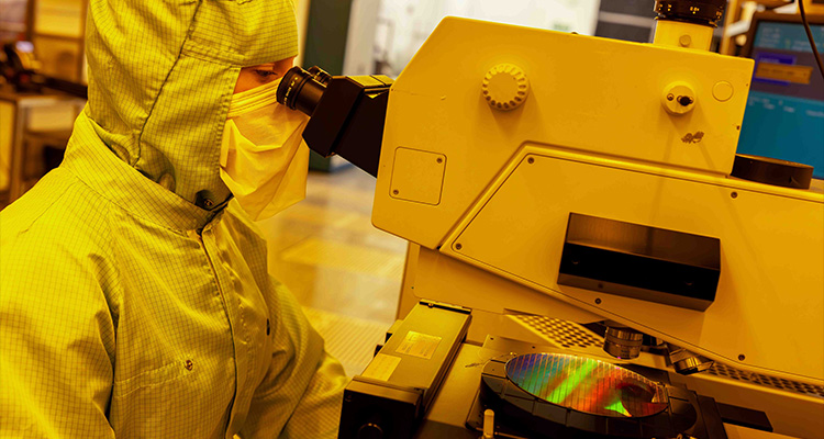 a person working in a cleanroom environment