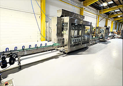 an industrial liquid bottle filling machine