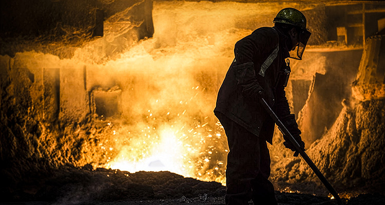 worker performing dangerous labor in a blast furnace