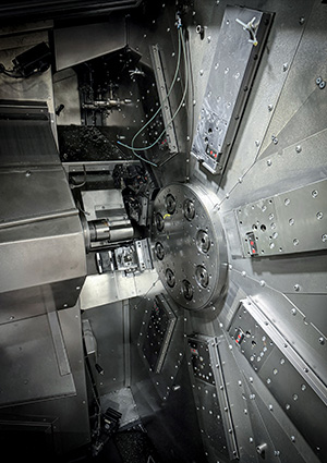 a Tornos MultiSwiss CNC multi-spindle automatic lathe. 