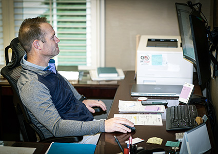 a person working at a desk in an office