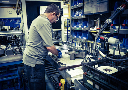 a technician hand-assembling a component