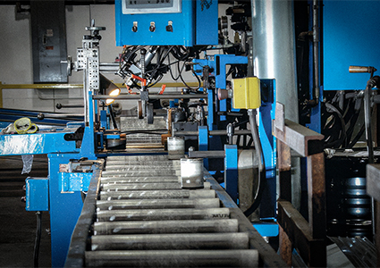 an industrial automated manufacturing machine used for processing metal parts