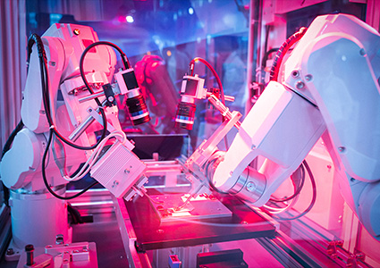 industrial robotic arms engaged in automated manufacturing processes