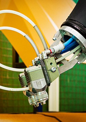 an industrial robotic arm equipped with an end-effector tool