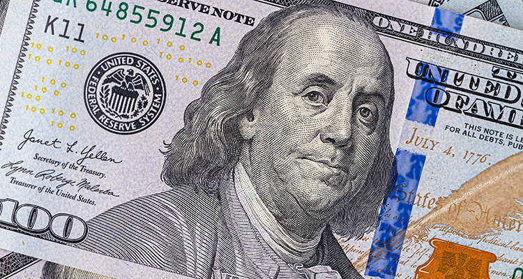 a United States one-hundred-dollar bill featuring a portrait of Benjamin Franklin.