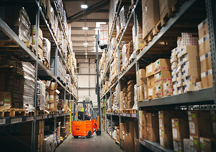 the interior of a large industrial warehouse.