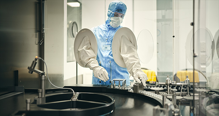 a worker in a sterile cleanroom environment