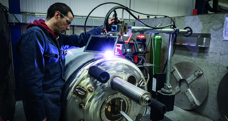 a technician performing industrial welding