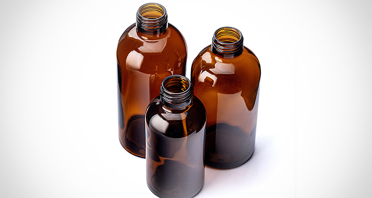 three amber glass bottles
