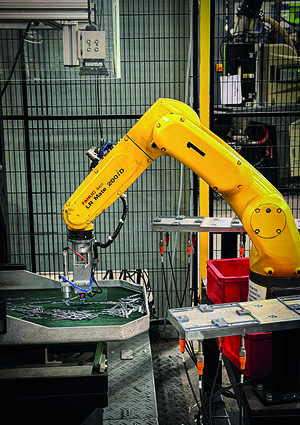 a industrial robot arm, specifically identified as a Fanuc LR Mate 200iD