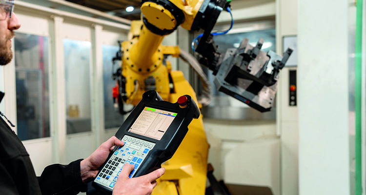 a yellow industrial robotic arm,