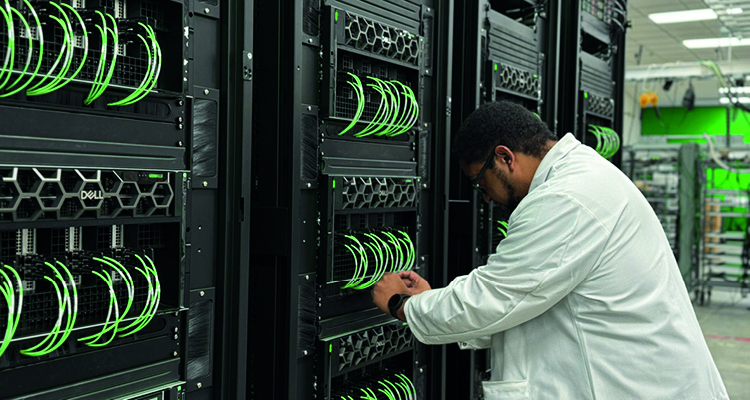 a technician working on Dell servers in a data center.