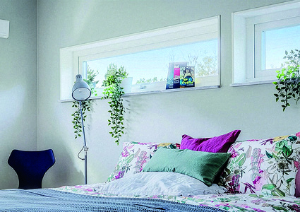 a bright and airy bedroom with a modern, minimalist aesthetic