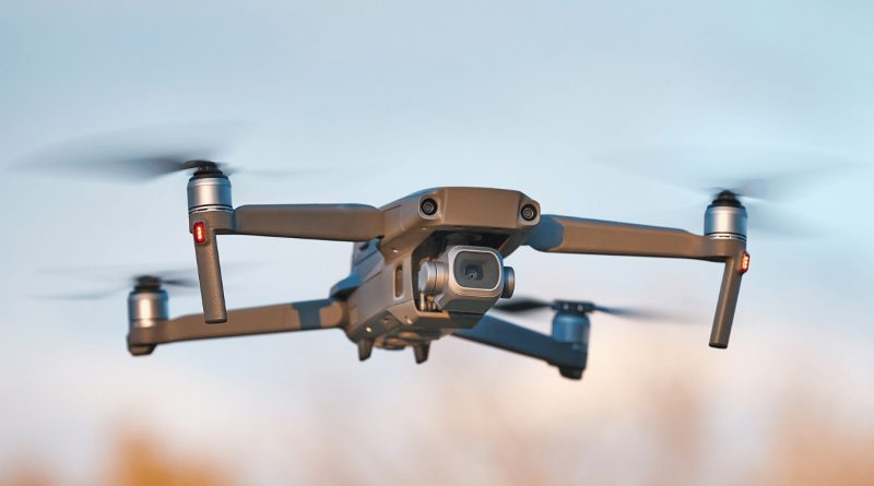 Police drone flying above an Ontario government building during a discussion on cybersecurity and public sector technology restrictions.