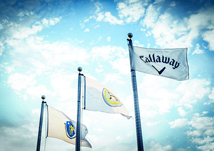 corporate brand flags flying outside a facility or event belonging to the Callaway Golf Company