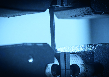 a high-pressure compressor check valve undergoing an automated operational or stress examination