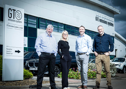 the executive leadership team of GT Emissions Systems Limited standing outside their corporate headquarters facility
