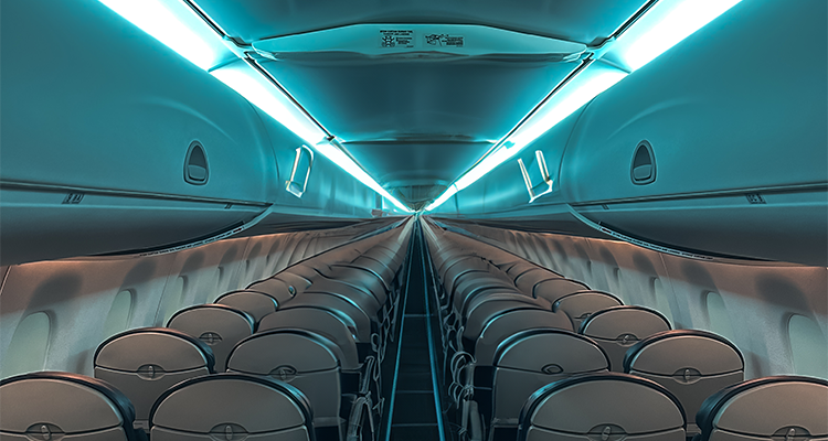 a modern aircraft cabin interior featuring Cobalt Spectrum LED mood lighting.