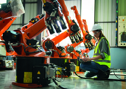 a maintenance engineer inspecting automated machinery