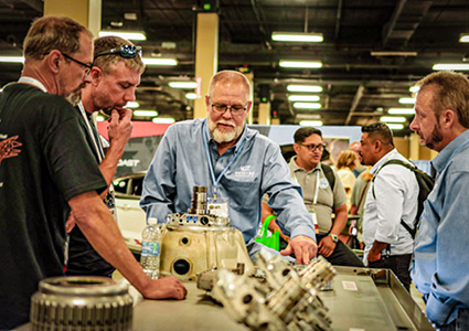 an interactive presentation taking place at an industrial trade show or technical seminar