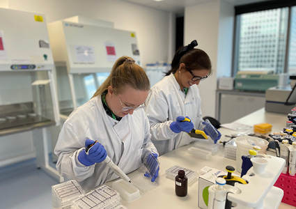 a clinical setting where healthcare professionals are conducting medical procedures.